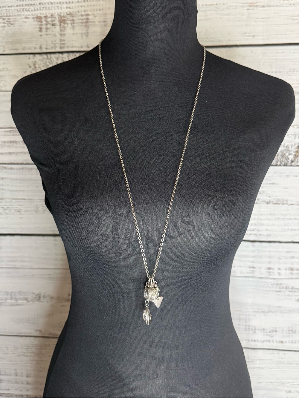 Long multi pendant silver tone necklace from The Buckle new